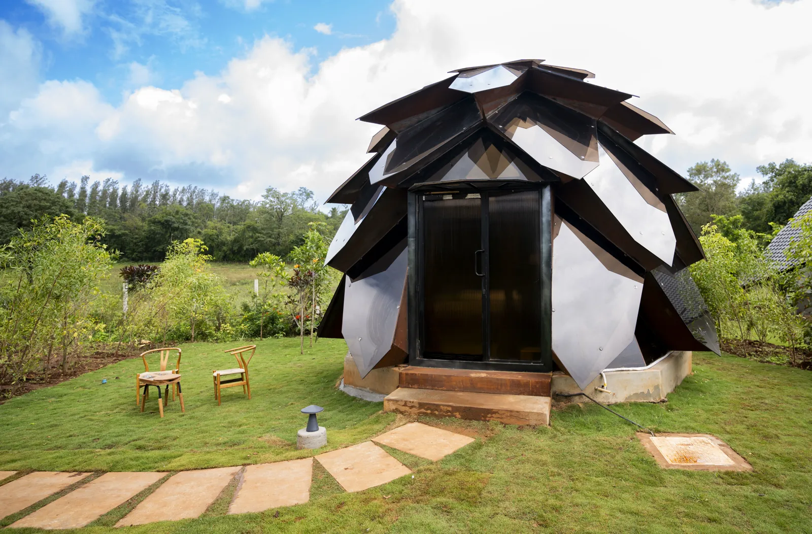 The Amber Chamber — exterior, the faceted corten shell