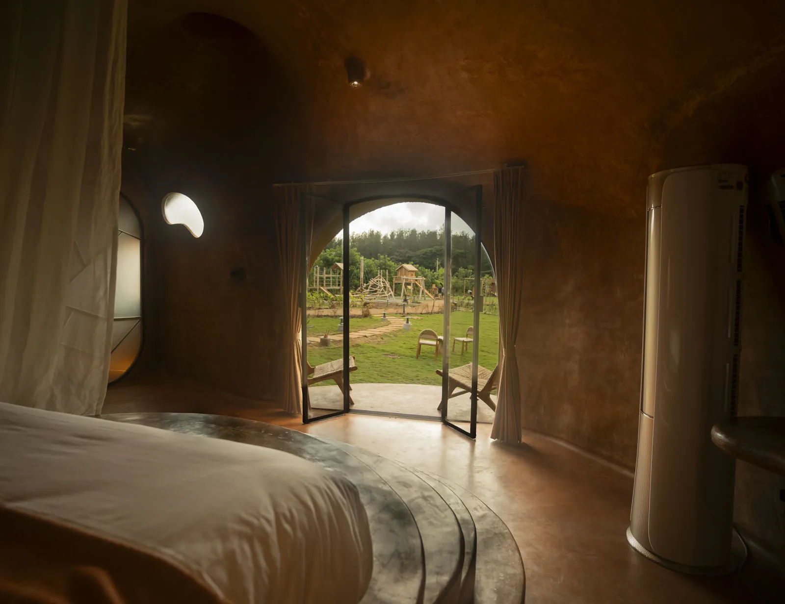 The Colony — the bed chamber opening onto the lawn