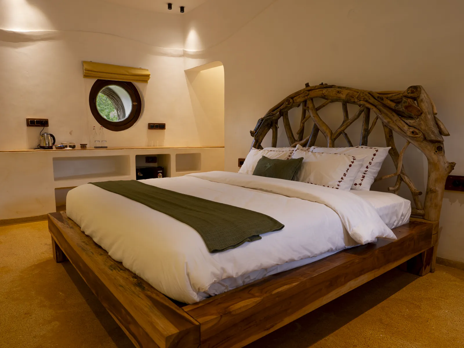 The Nest — the bedroom and its branch headboard